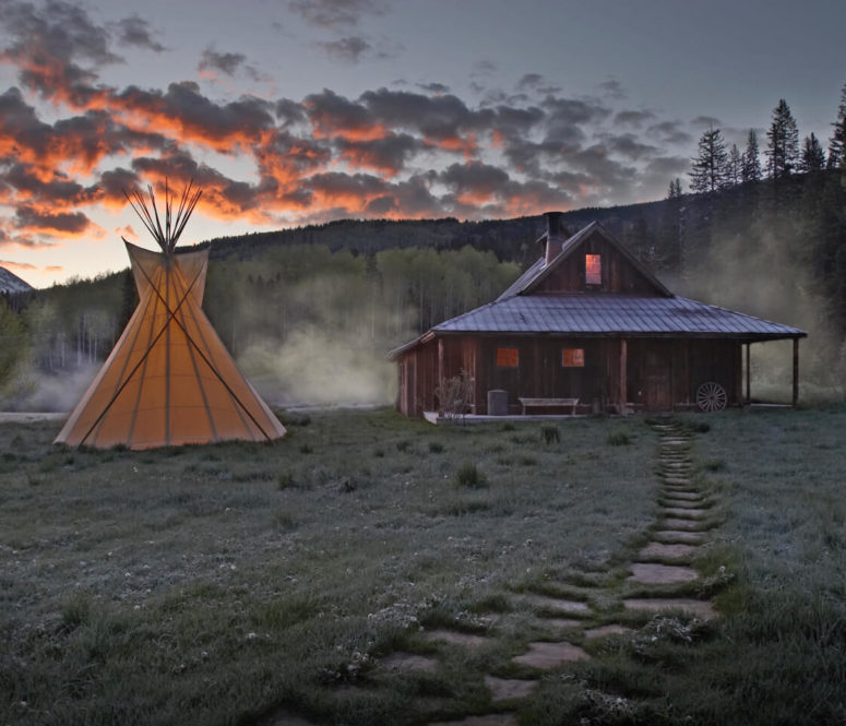Bathhouse and tipi at dawn